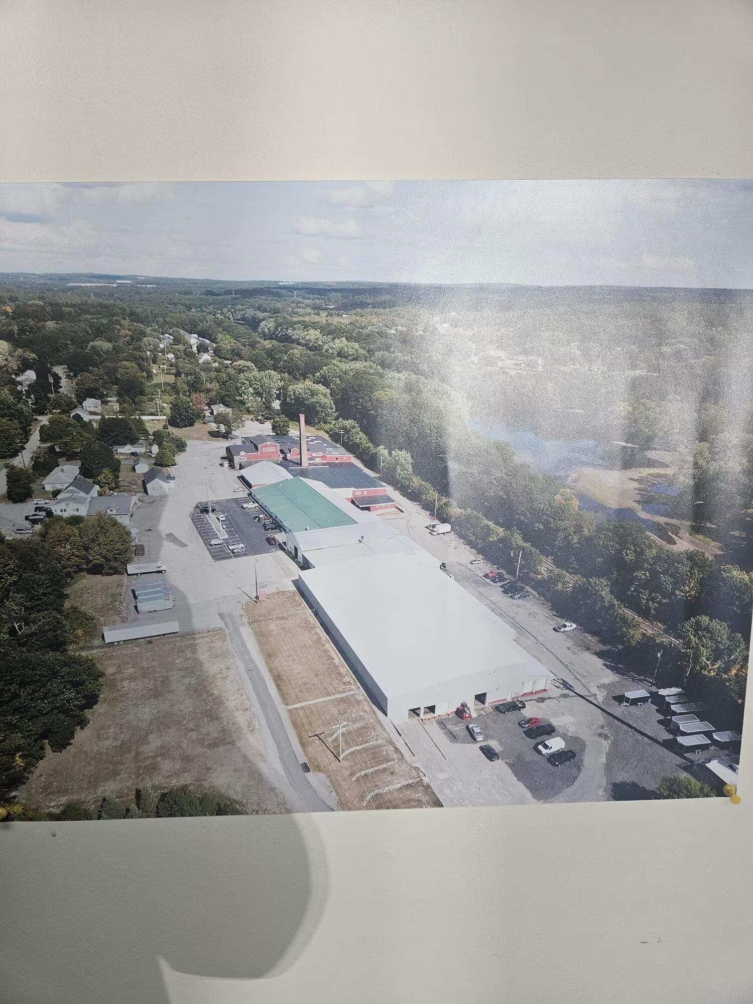 Aerial view showing the 10.6 acre campus layout of 33 Elm St, Merrimack NH