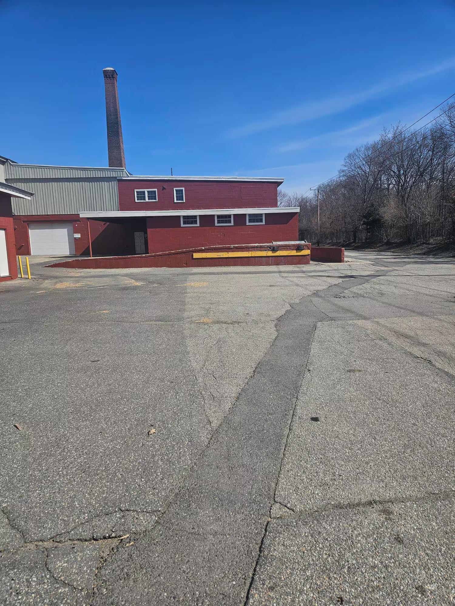 Wide rear trailer court showing circular truck roads and dock lanes